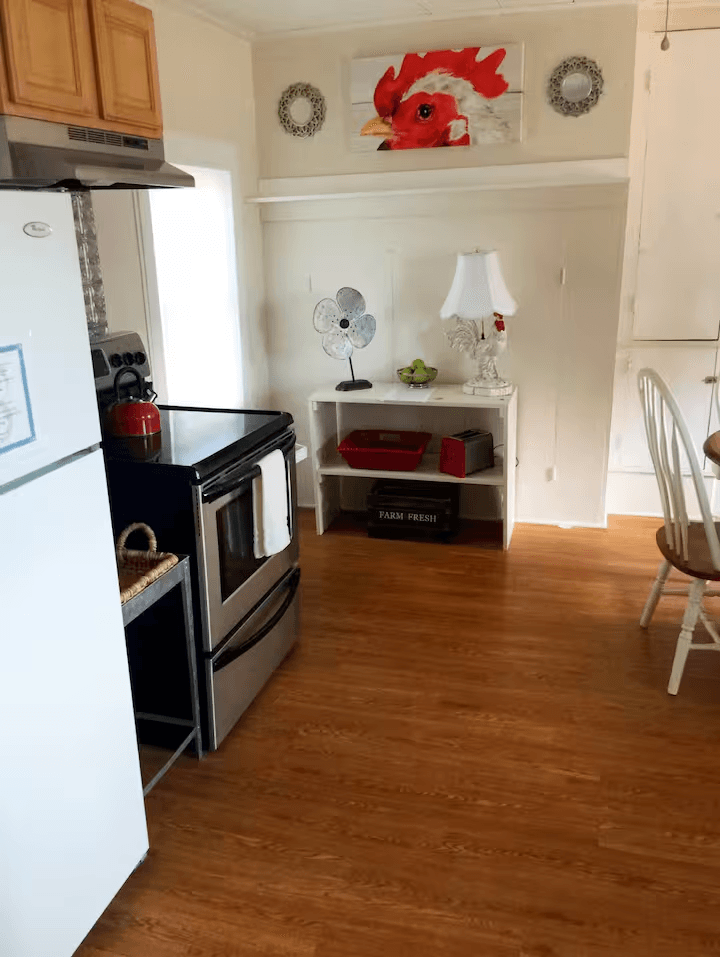 downstairs kitchen, seats 4, table extends and folding chairs are provided