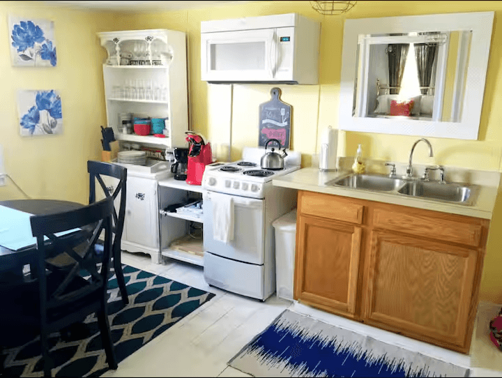 Kitchen, note kitchen table seats 4, there is an additional table in living room and folding chairs available
